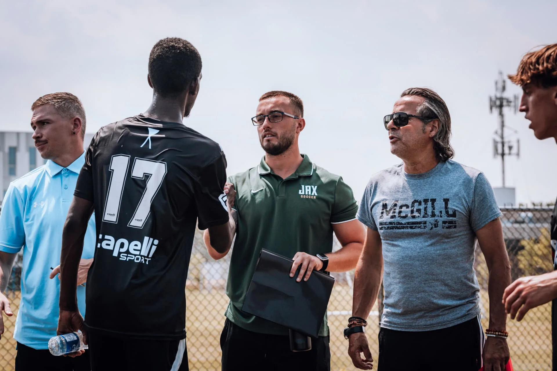 OPSM advisors and college coaches meeting players at an event