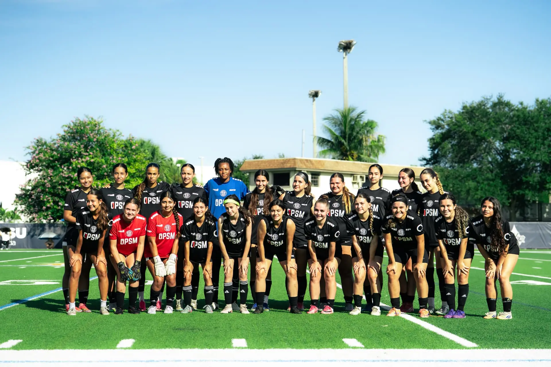 Girls squad team photo in black kits at NSU Florida
