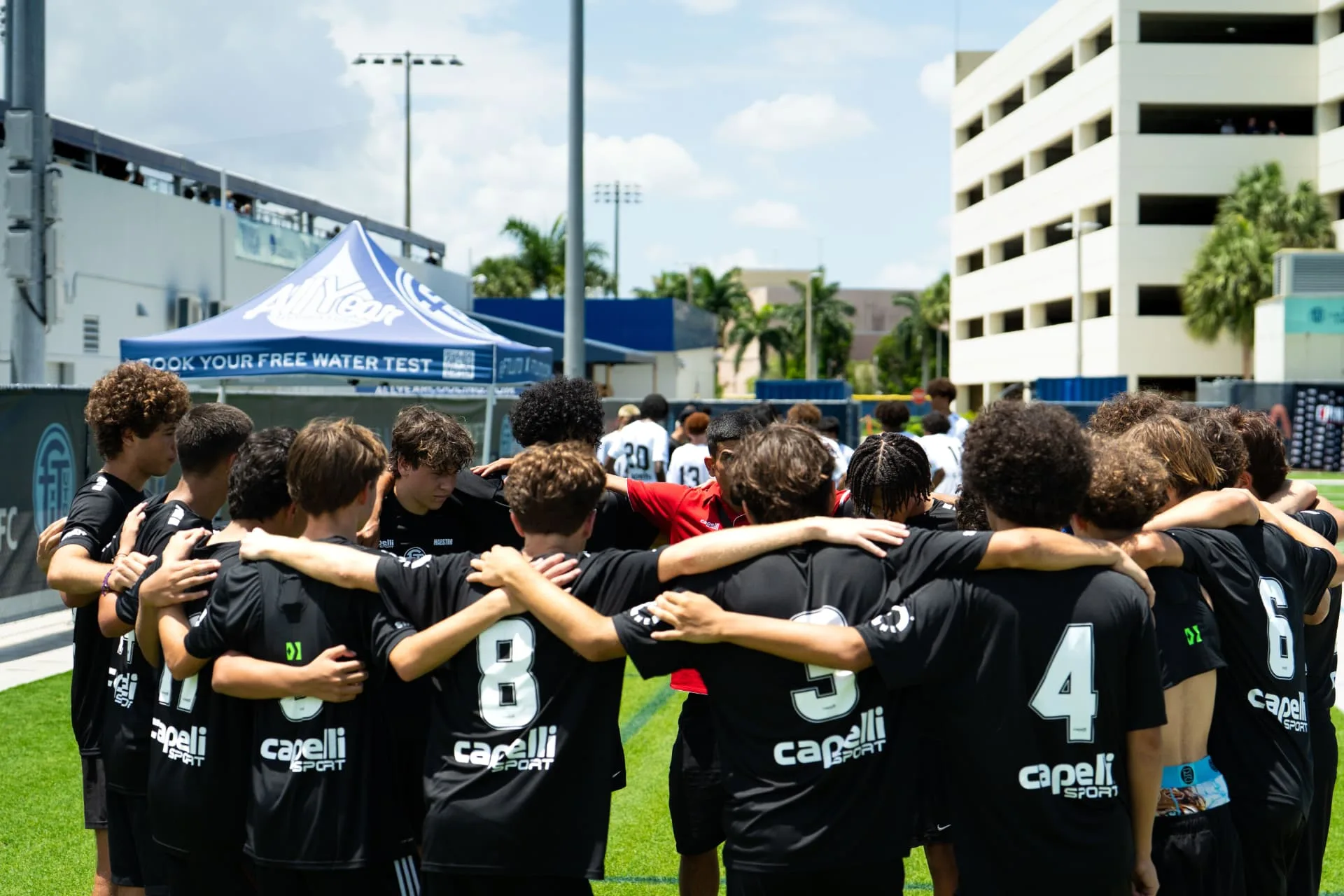 Team huddle before kickoff at the combine