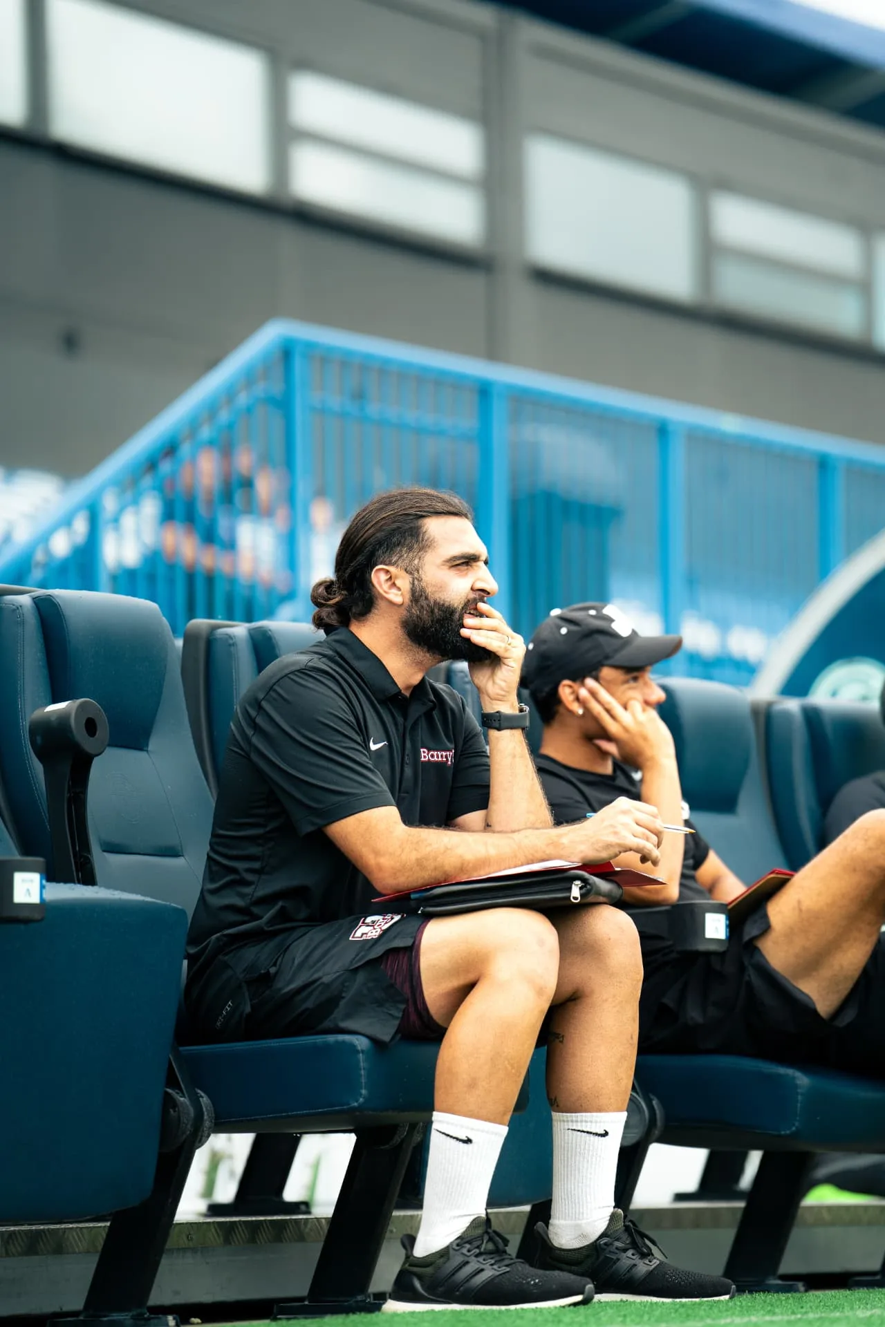 College coaches evaluating players from the stands