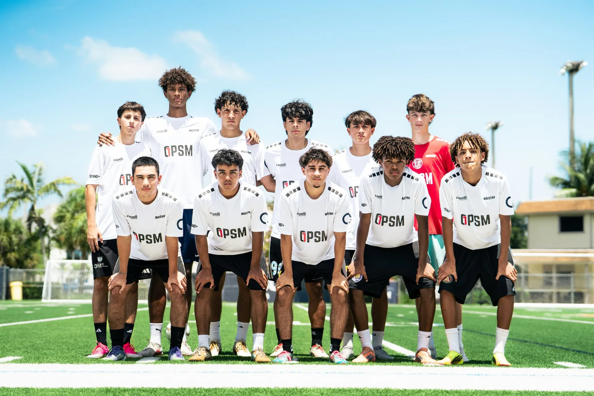 Team photo of the white squad at midfield