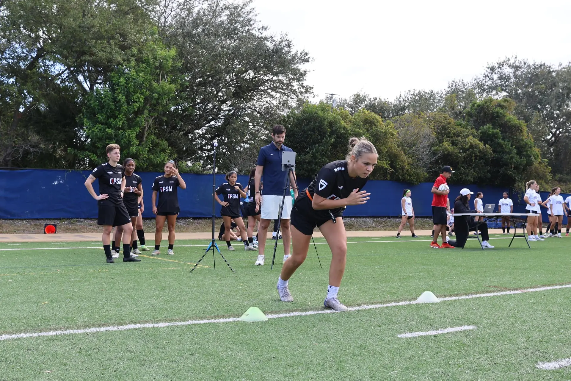 Player accelerating through a timed sprint testing station