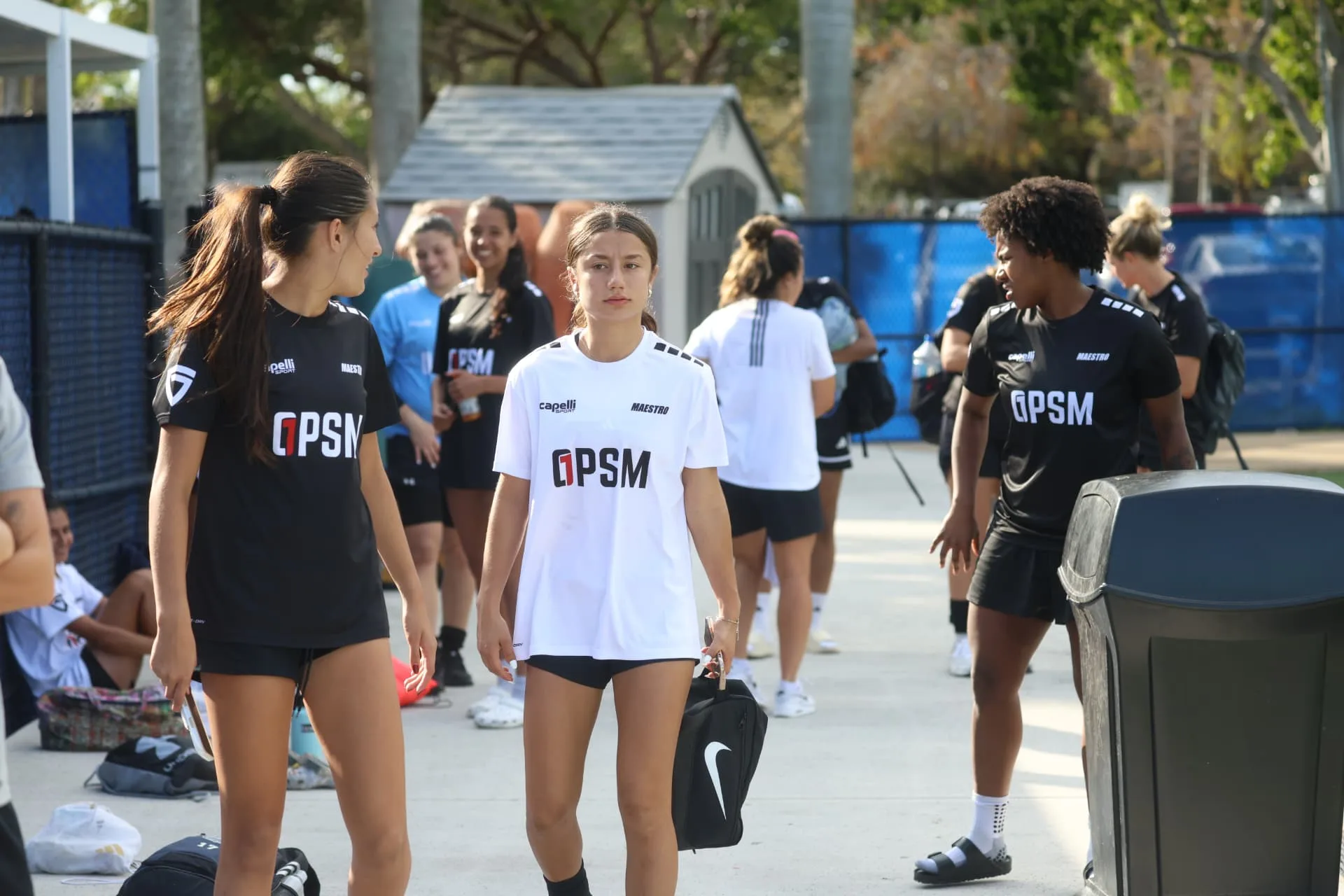 Players in OPSM kits walking to the field before the session