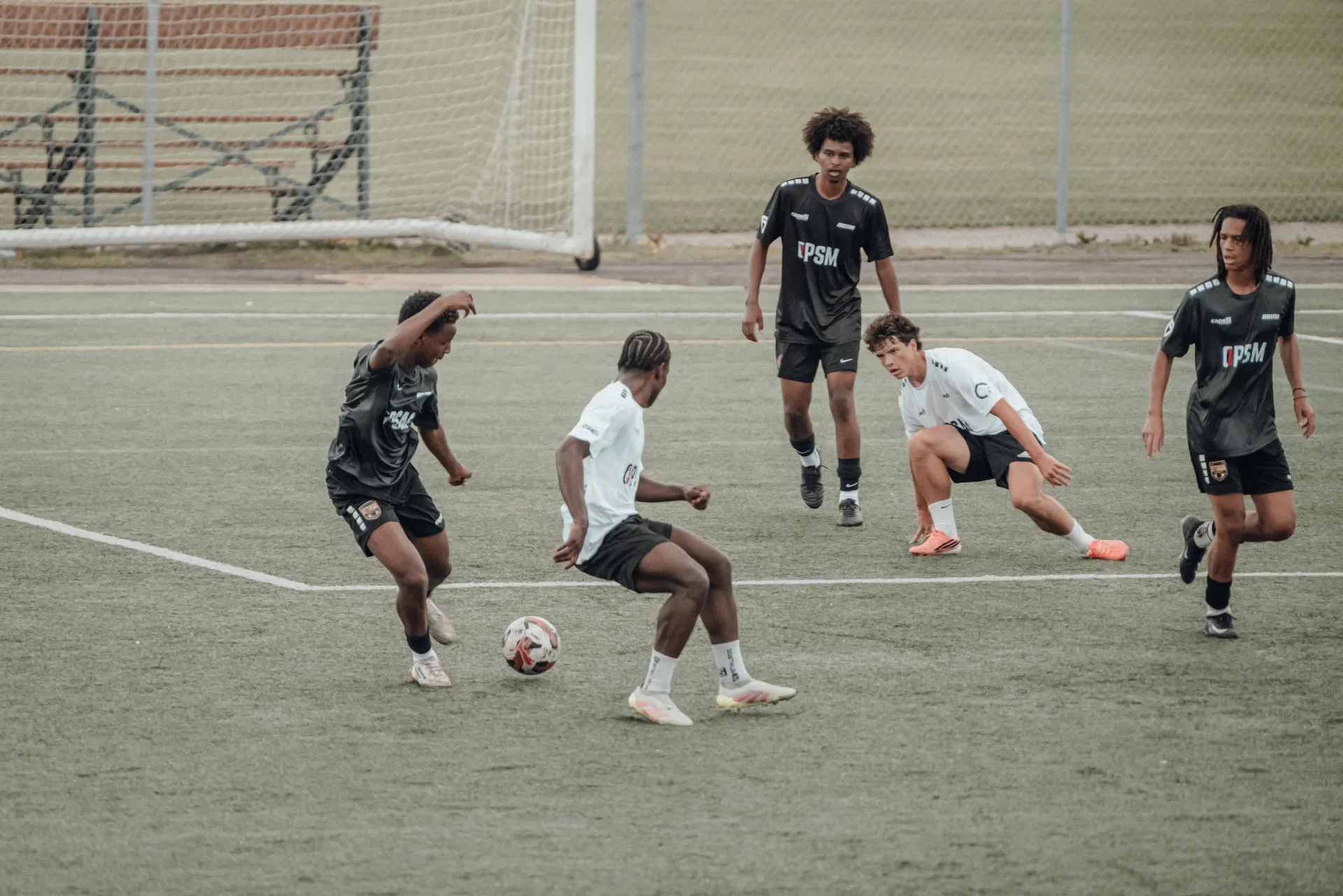 Midfield scramble for a loose ball during live play