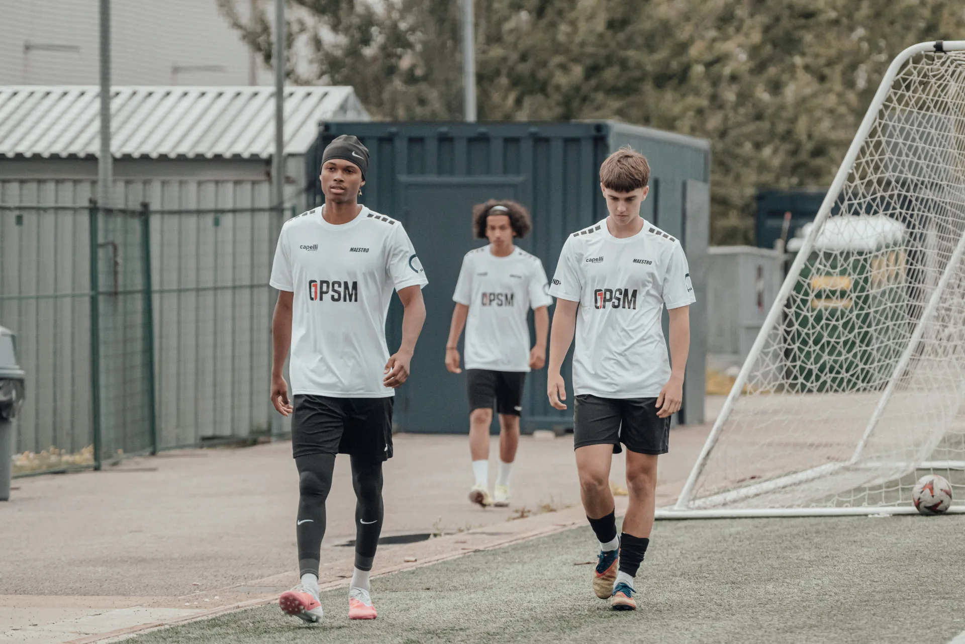 Players in white OPSM kits heading out for their session