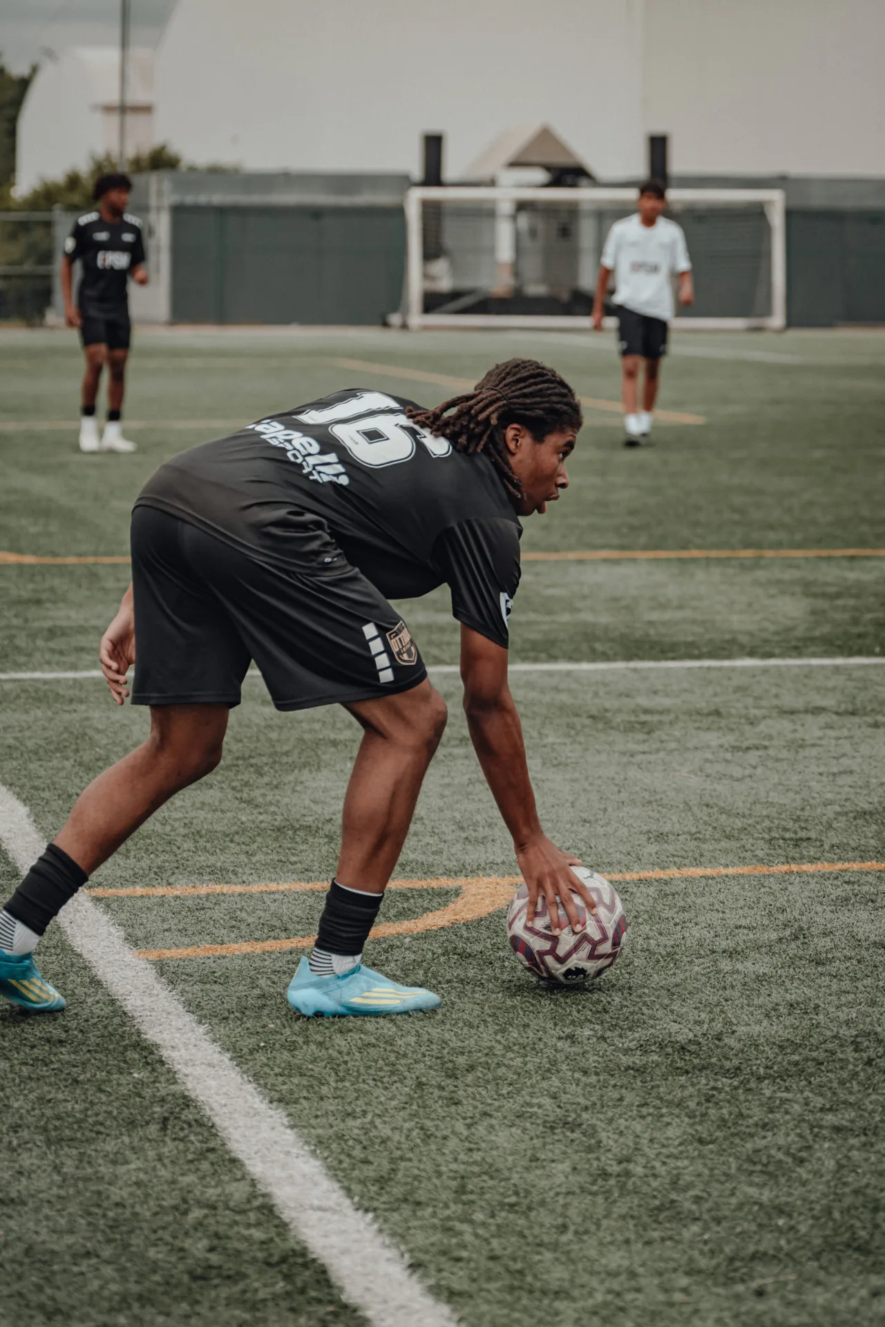 Player placing the ball down for a set piece