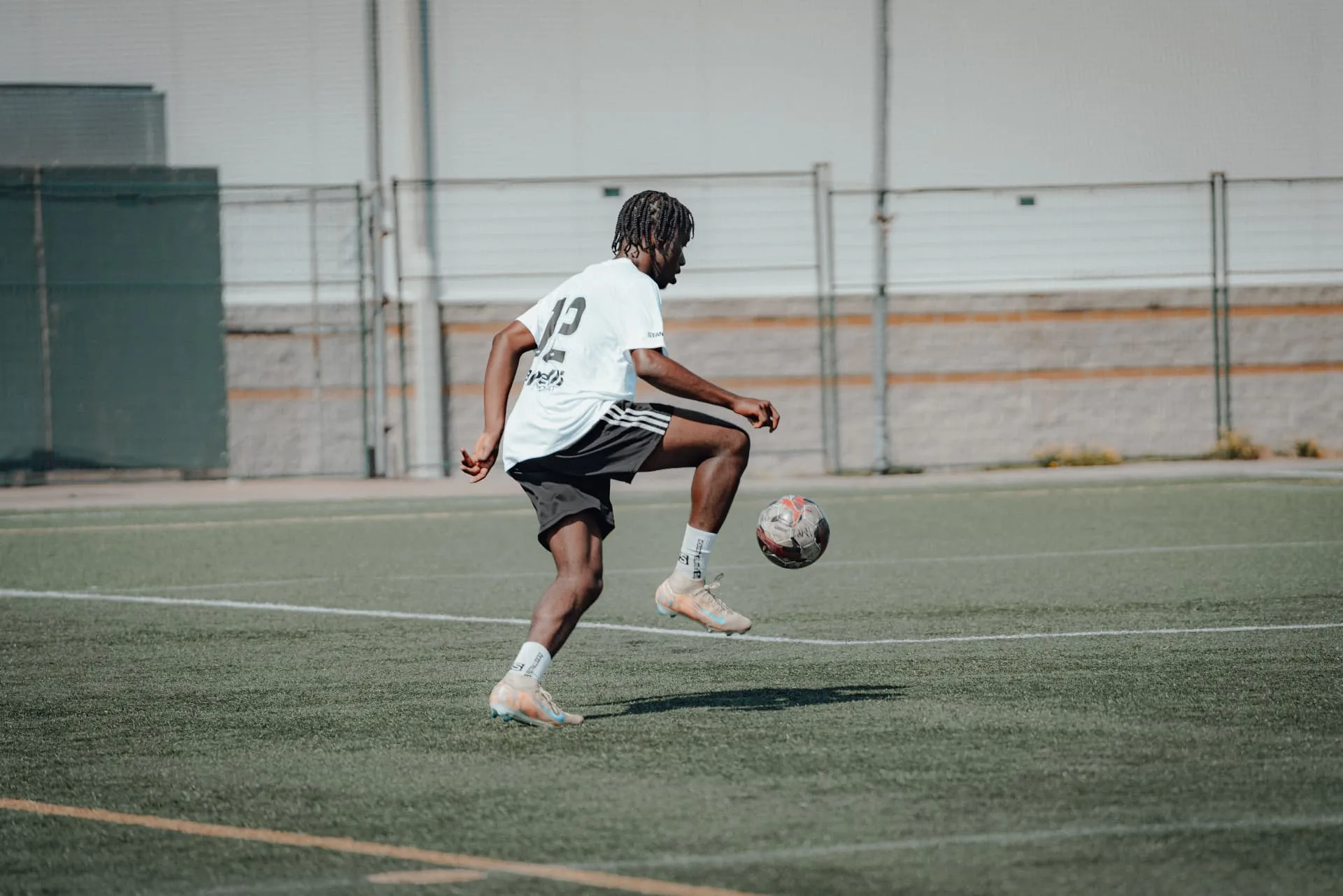 Player controlling the ball in the air during warm-ups