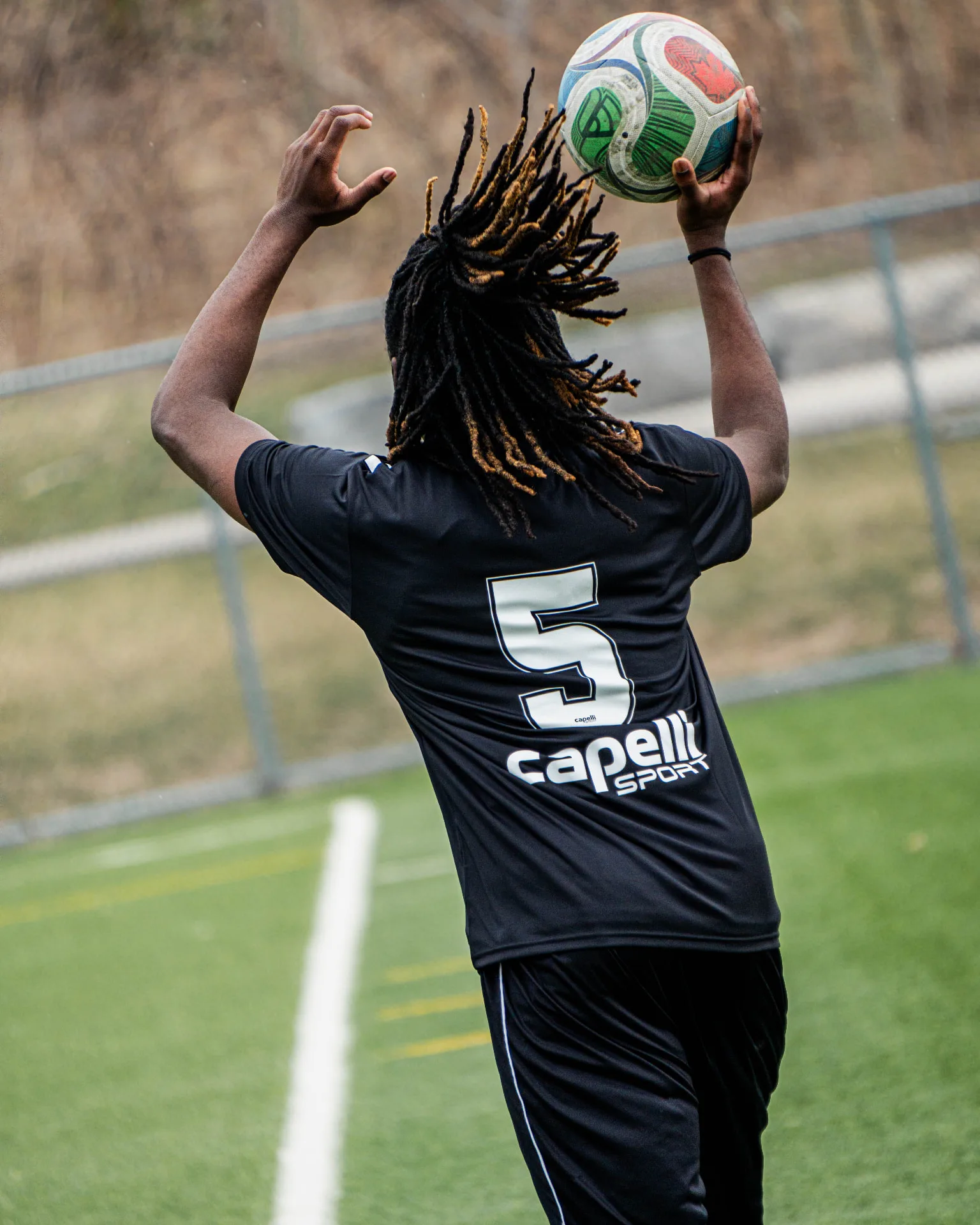 Player taking a throw-in during the combine match