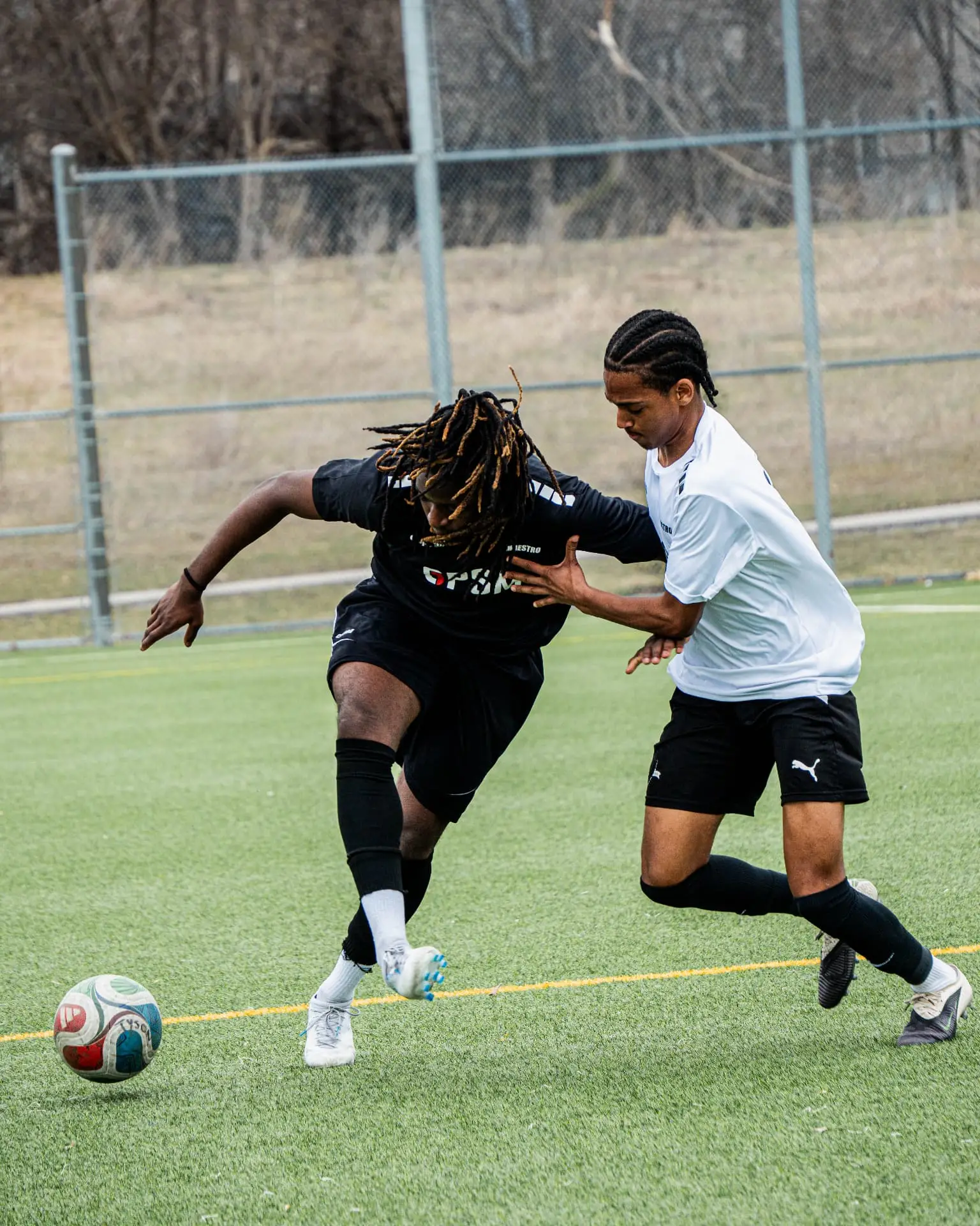 Attacker driving past a defender down the wing